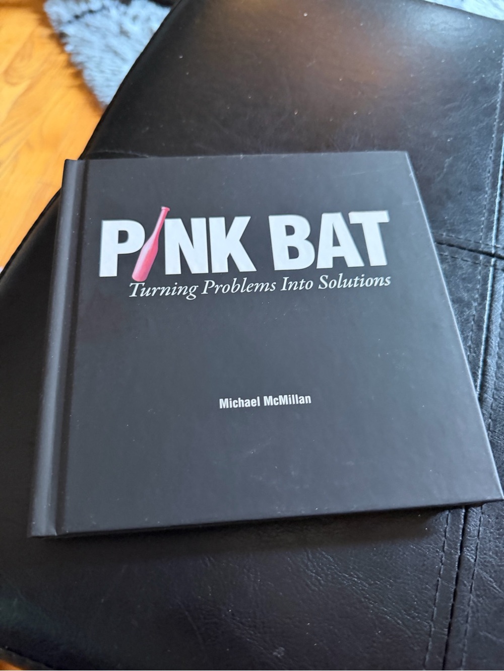 Pink Bat: Turning Problems Into Solutions - Black and Pink Coffee Table Book